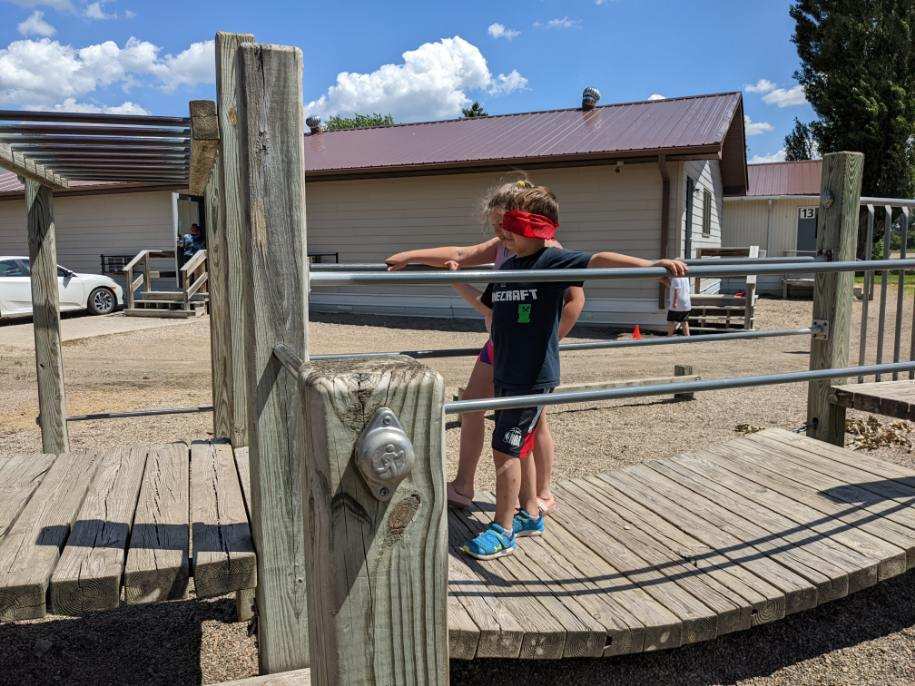 children being guided around the playground