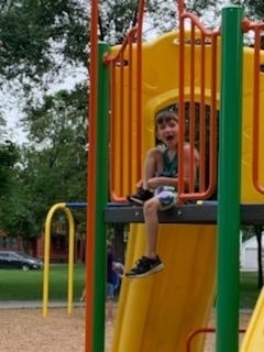 a boy on the playground equipment 