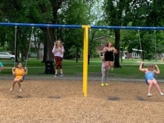4 girls swinging