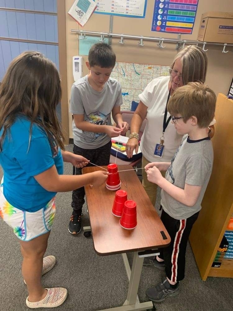 working together to move cups