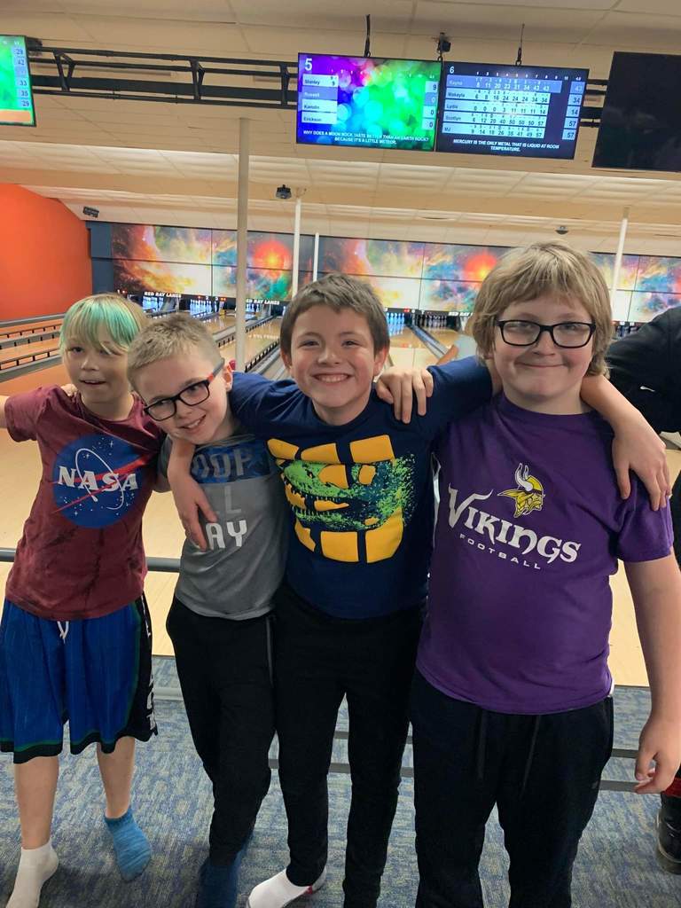 Boys enjoying bowling.