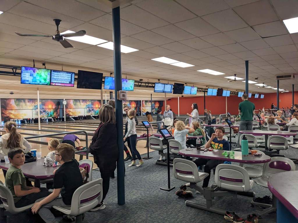 Everyone enjoying bowling.