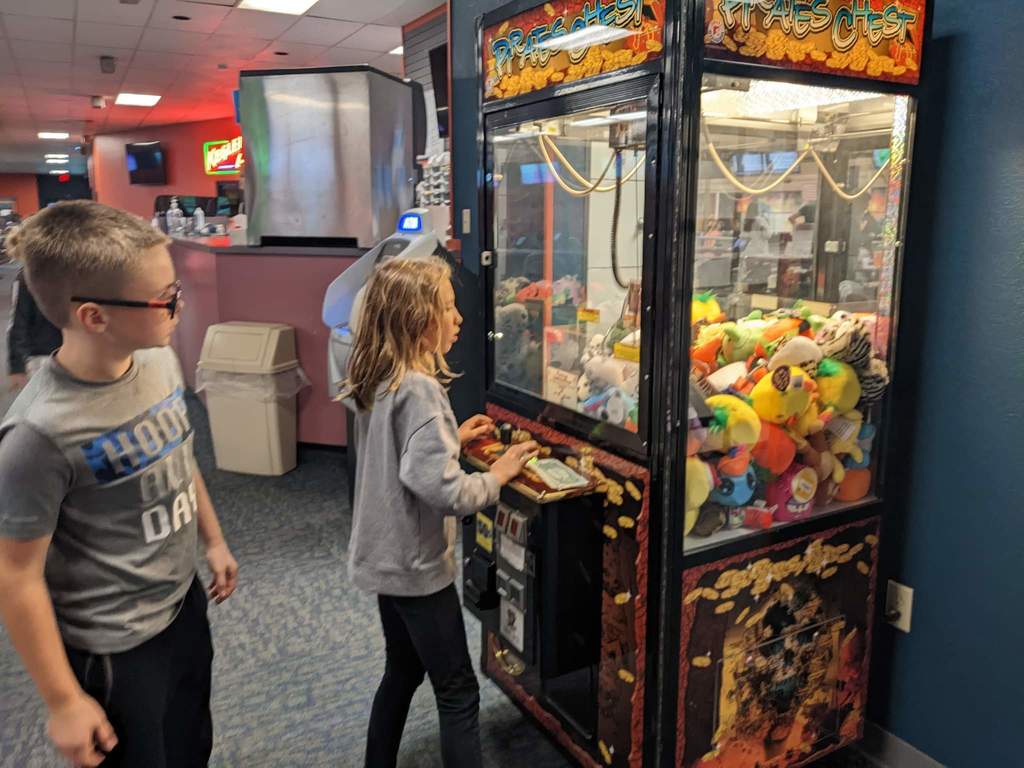 Students playing on the claw machine