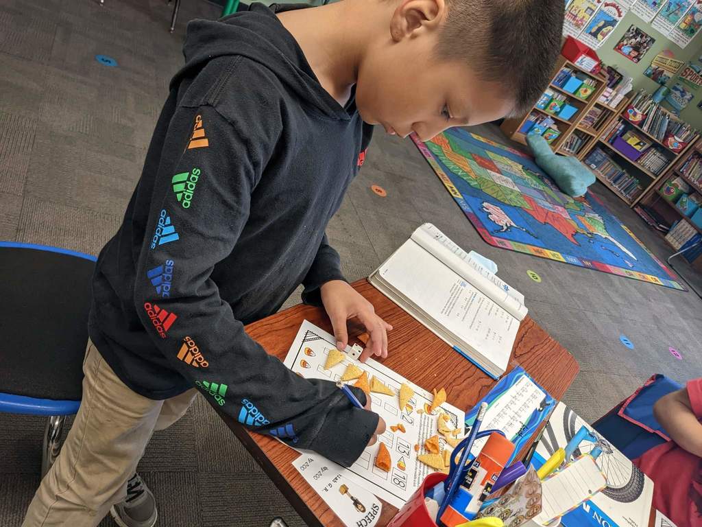 A boy working with math.