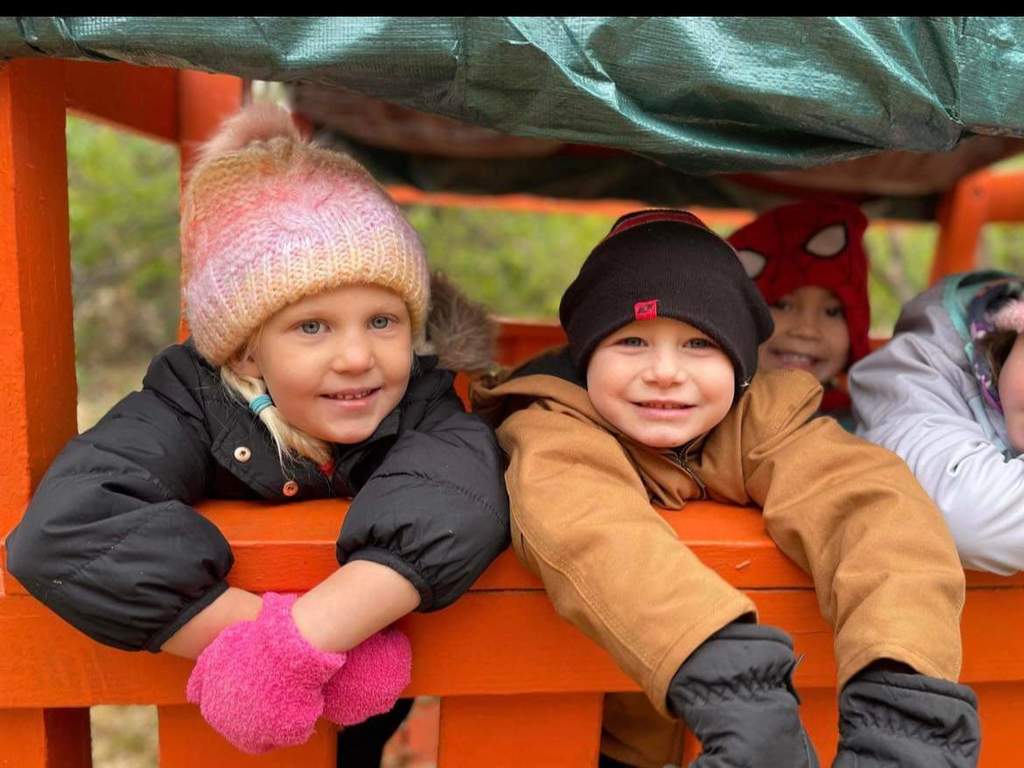 Kids smiling in the fort.