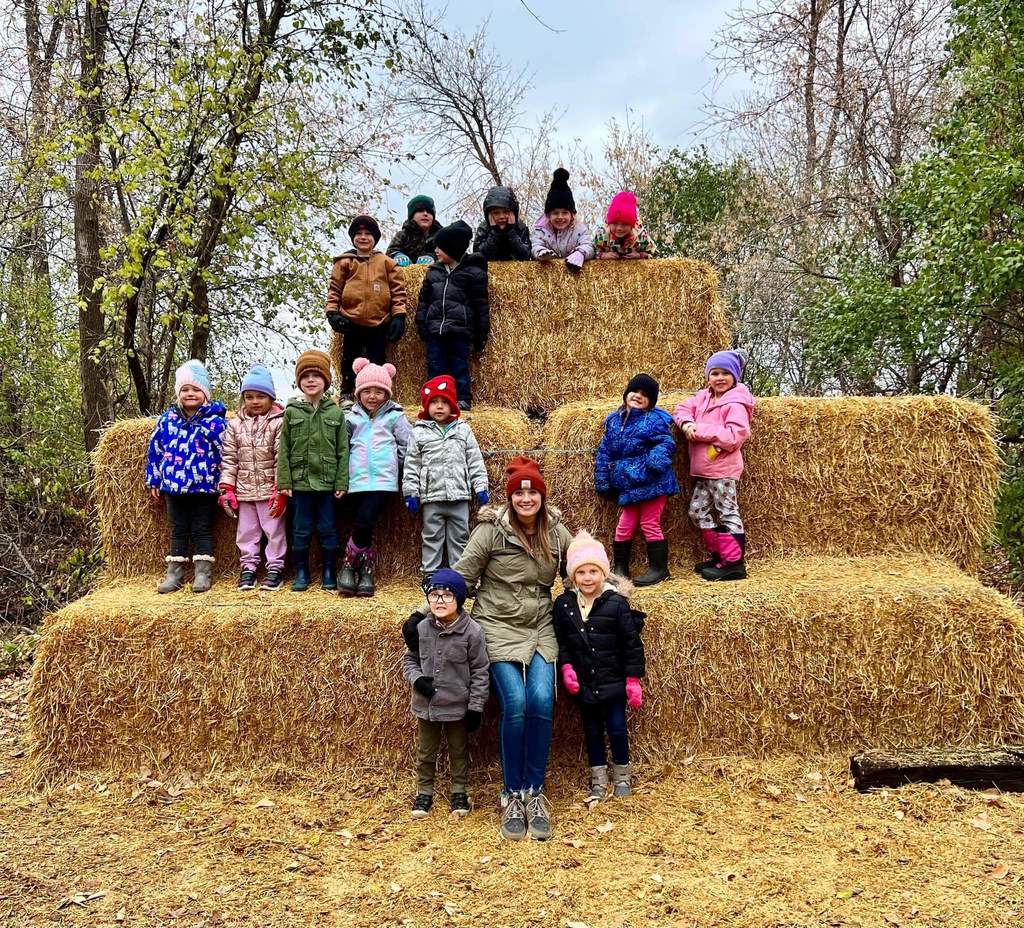 Preschoolers on the haystacks.