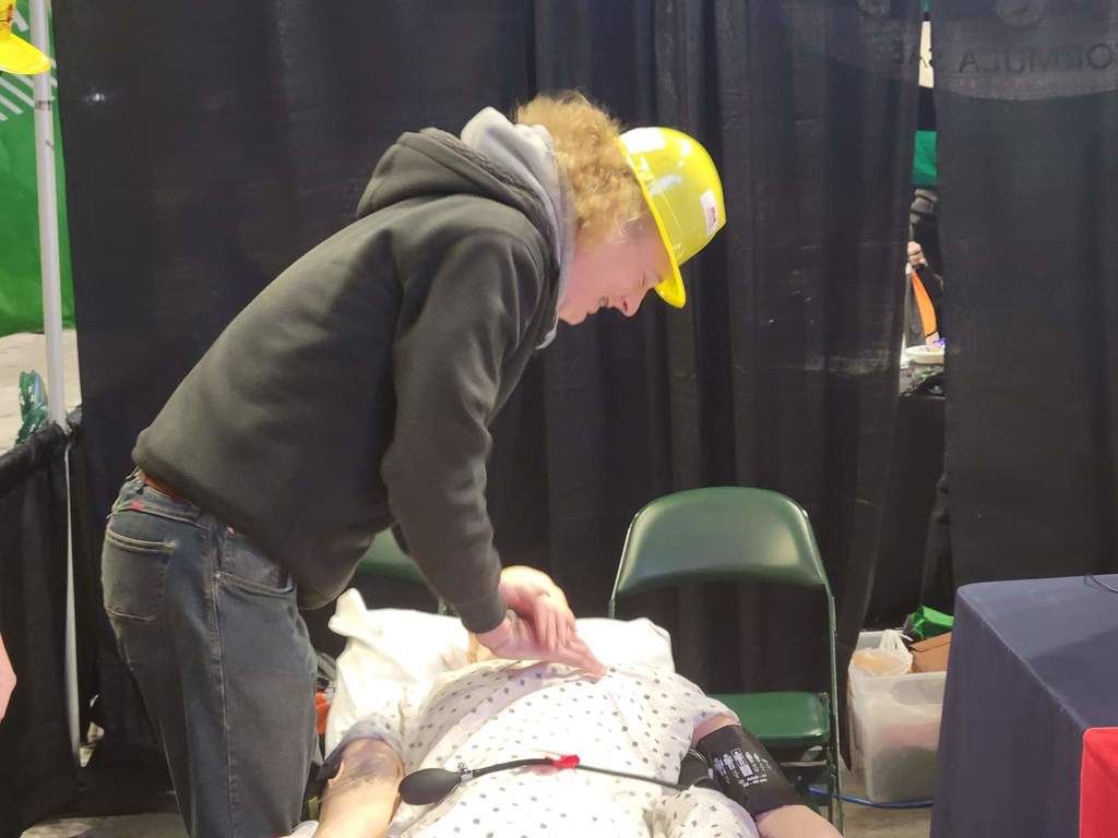 A boy doing cpr