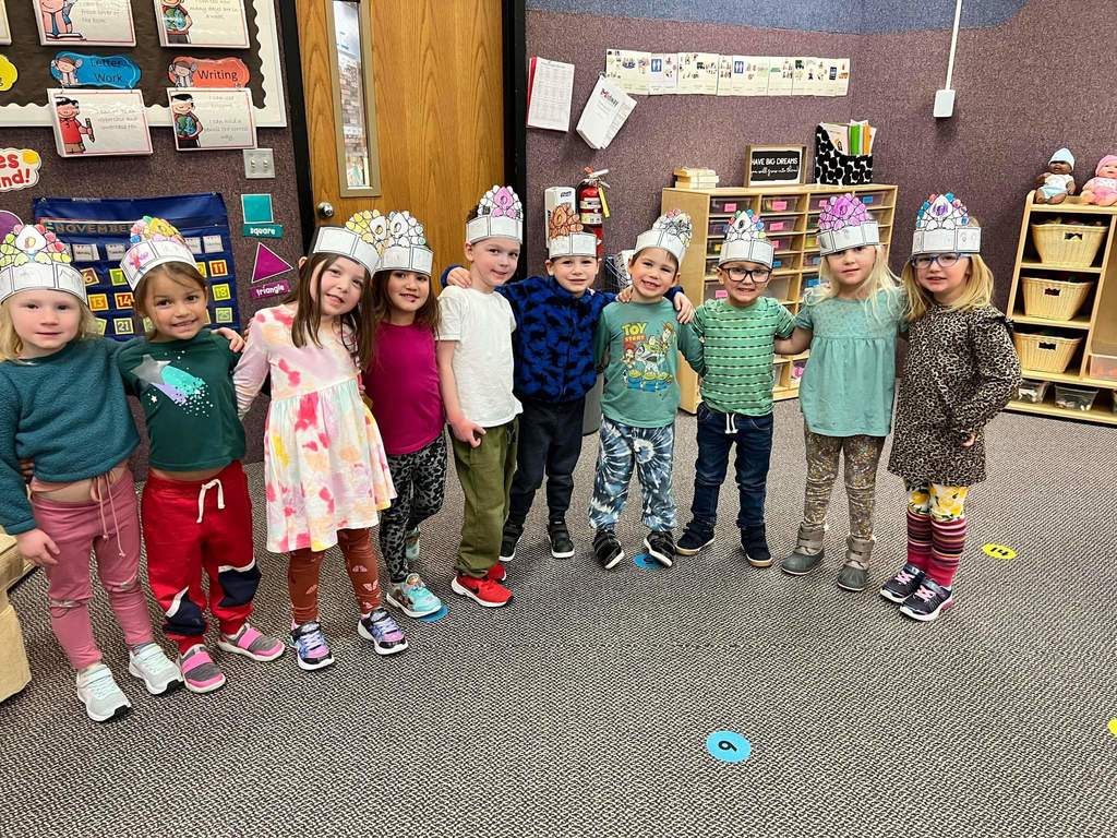 The preschool class wearing their turkey hats.