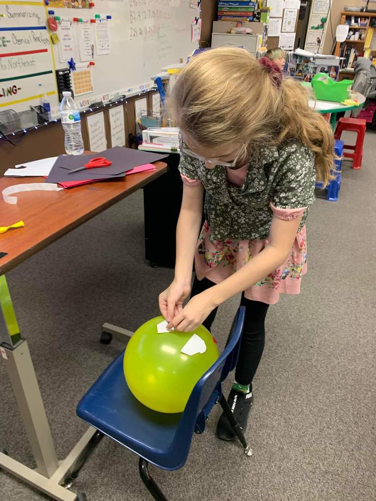 A student working on their balloon character.