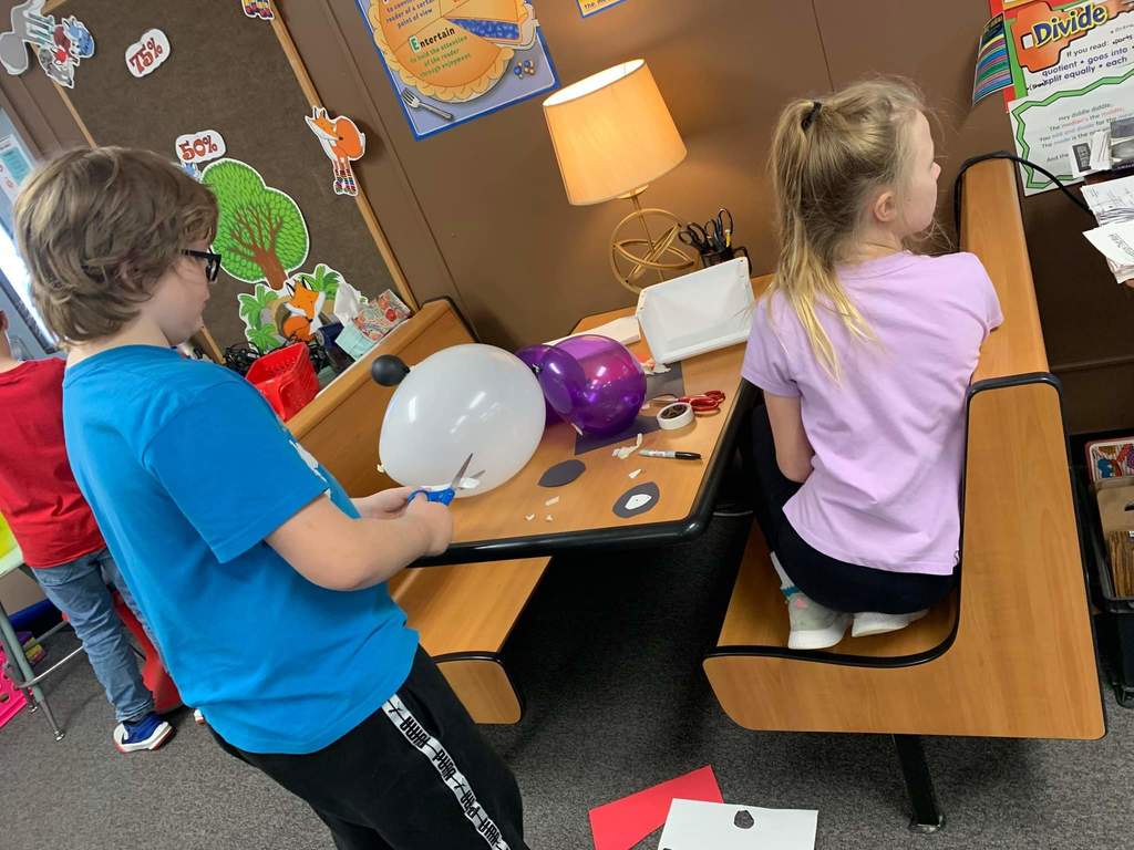 Two students working on their balloon.