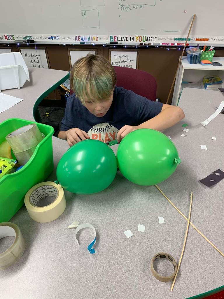 A student works on his balloon character.