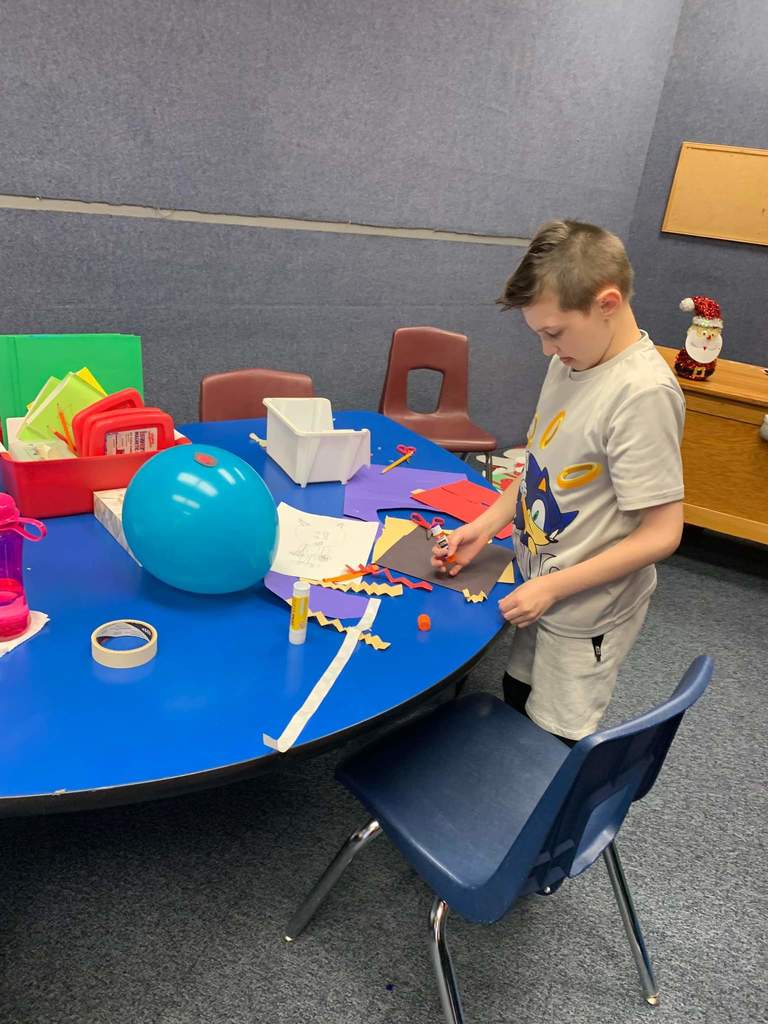 A student working on his balloon.