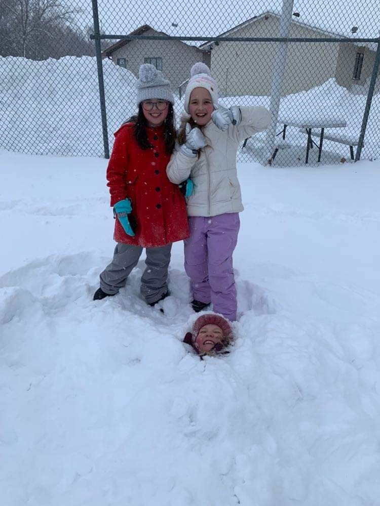 We buried friends in the snow.