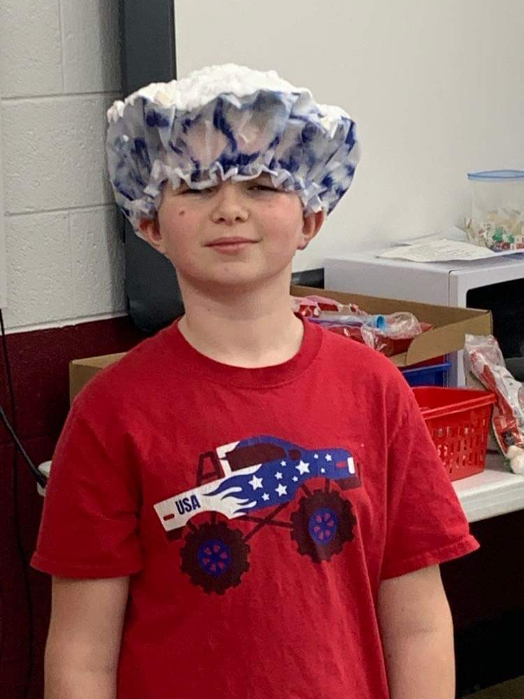 Shaving cream on a students head.