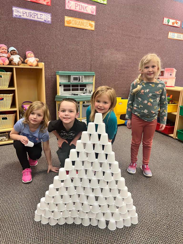 Students stacking 100 cups.