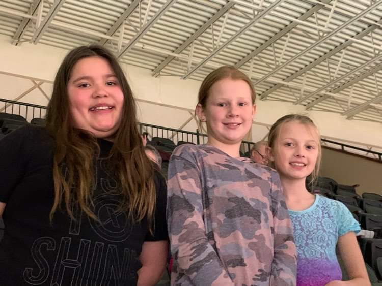 3 girls at a basketball game