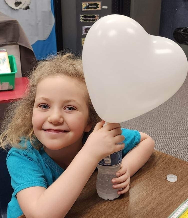 a girl and her balloon