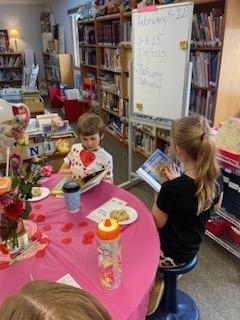 Kids reading books at the table
