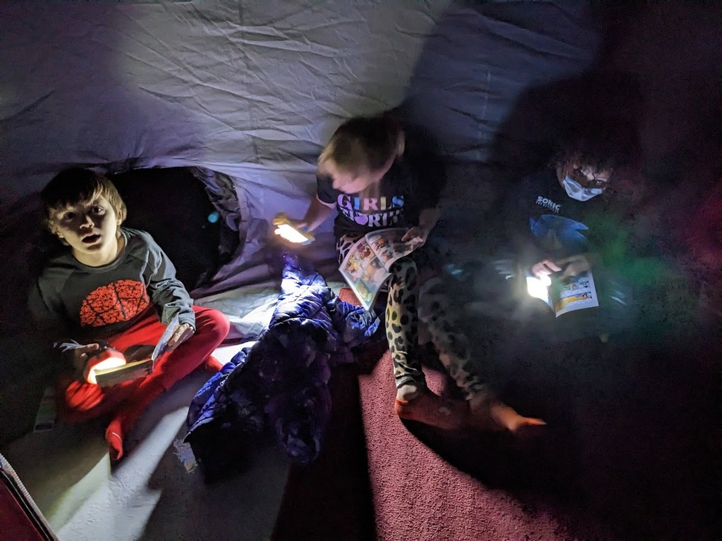 kids reading in the dark