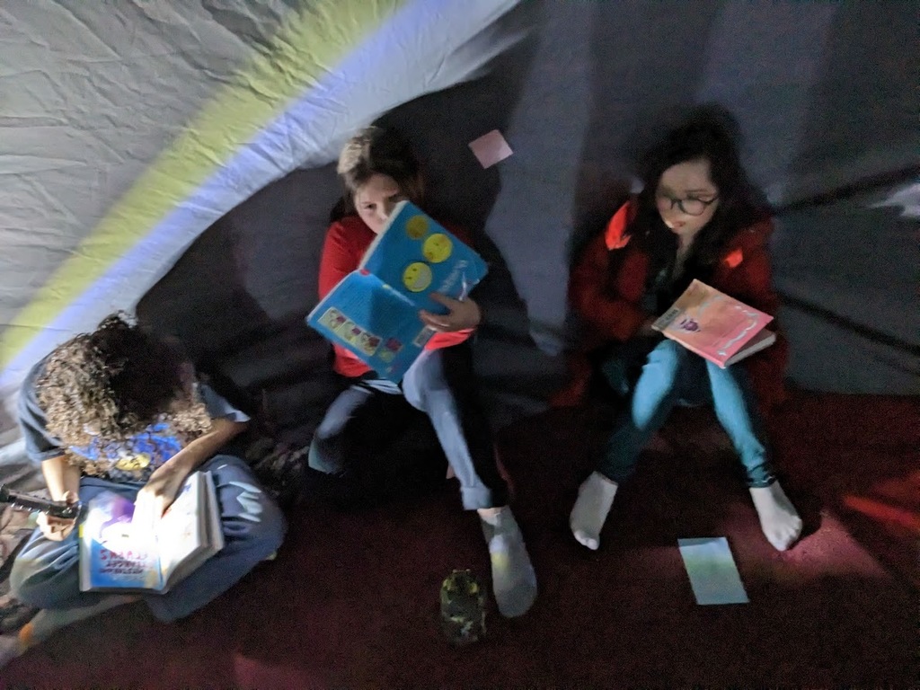 girls enjoying reading
