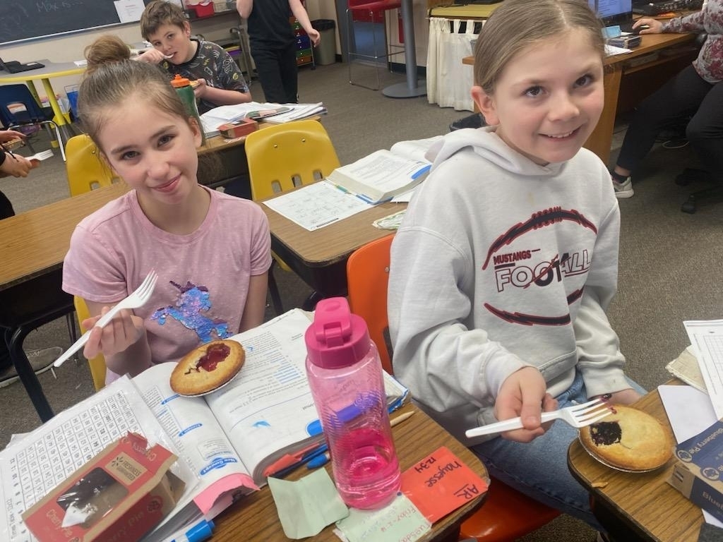 girls enjoying their pies