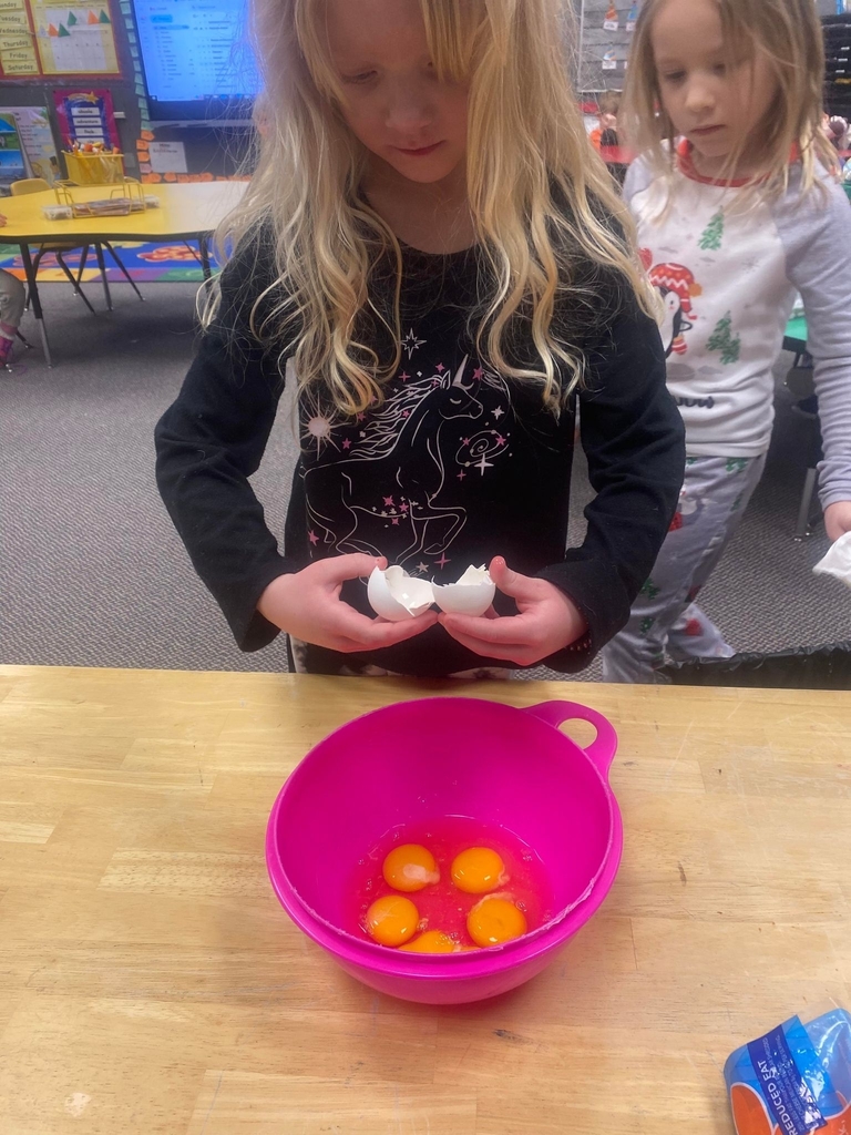 a student cracking another egg