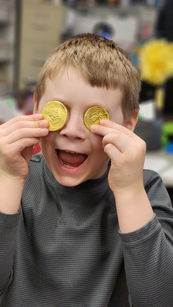 a boy with 2 coins
