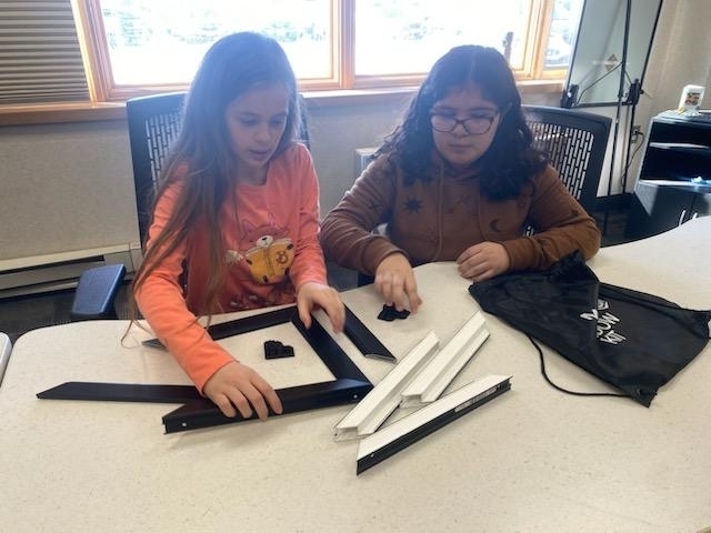 students putting together frames
