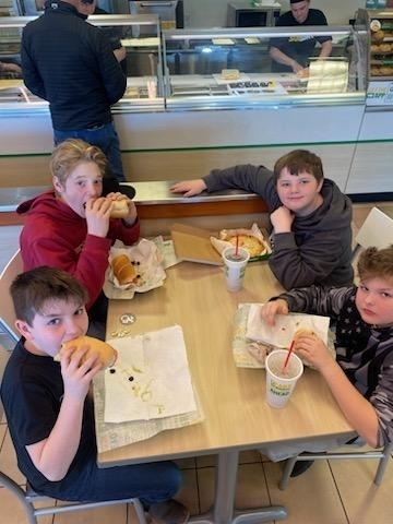 boys eating at subway