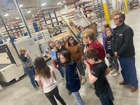 students learning about window manufacturing 