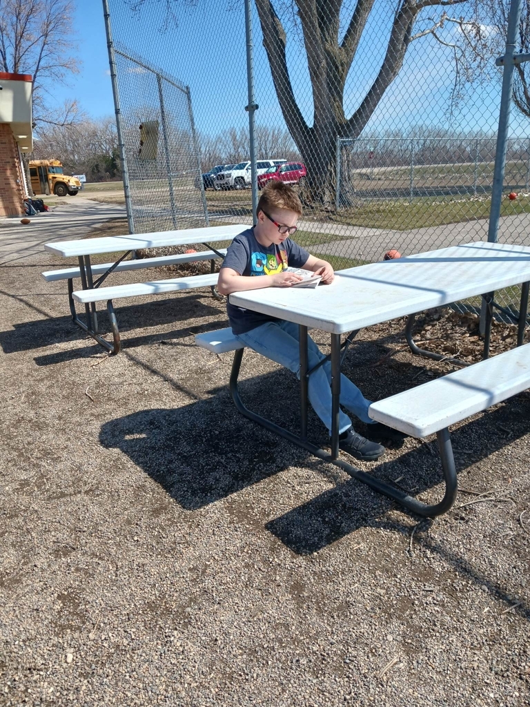 reading at the picnic table