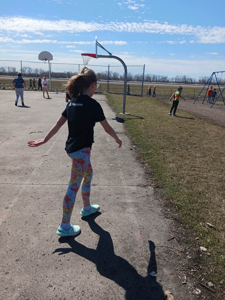 a girl walking on the basketball court