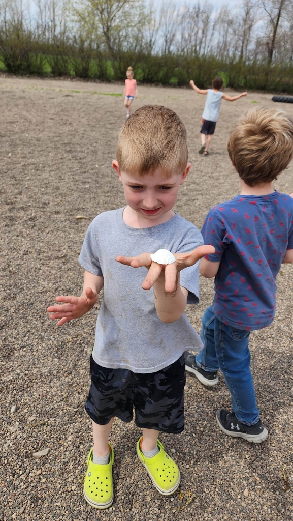 a boy holding his shell