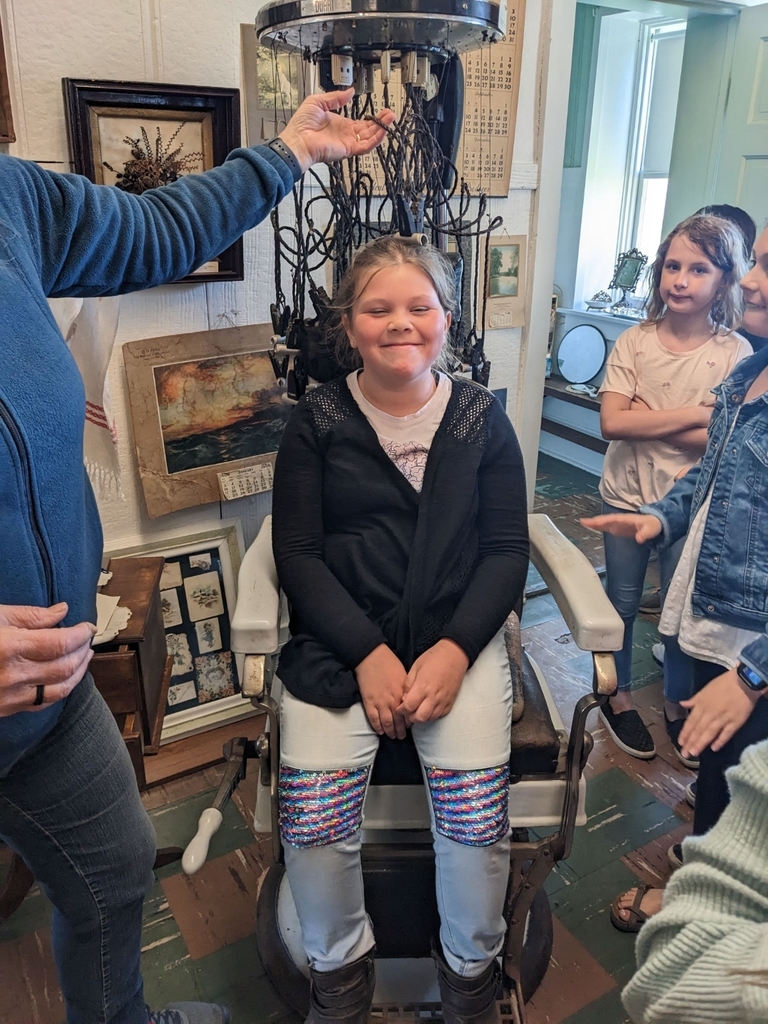 a girl sitting on a chair