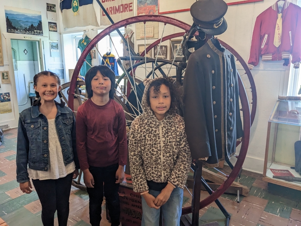 Kids in front of a wheel
