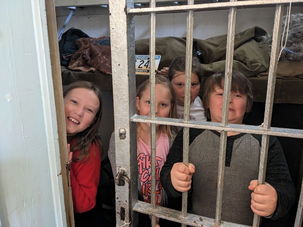 Kids checking out the jail