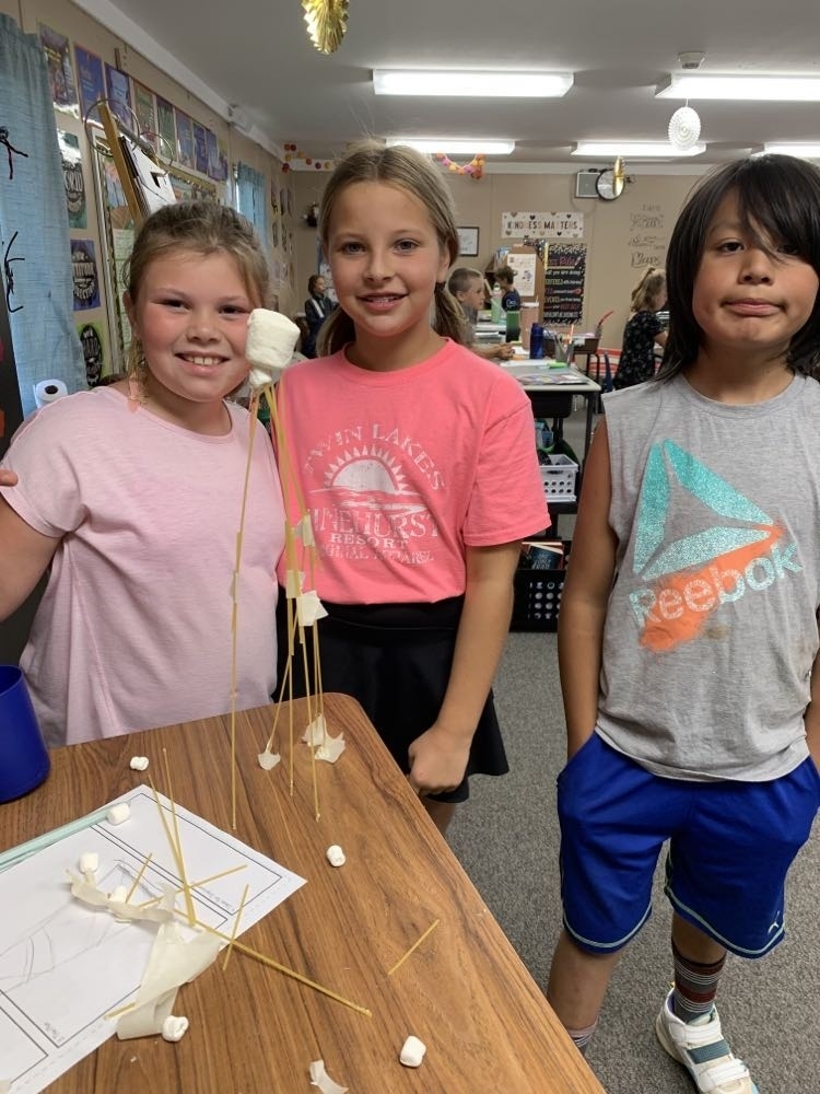 3 students with their spaghetti tower